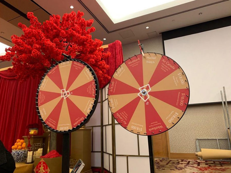 Two customized Promo wheel rentals set up for an event.